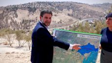 Israeli Finance Minister Bezalel Smotrich with map of Israeli West Bank settlements