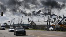 Cars drive past a chemical plant in Norco, Louisiana, in 2021.