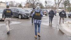 Federal agents execute a search warrant at a business as part of a fraud investigation in Bloomington, Minnesota